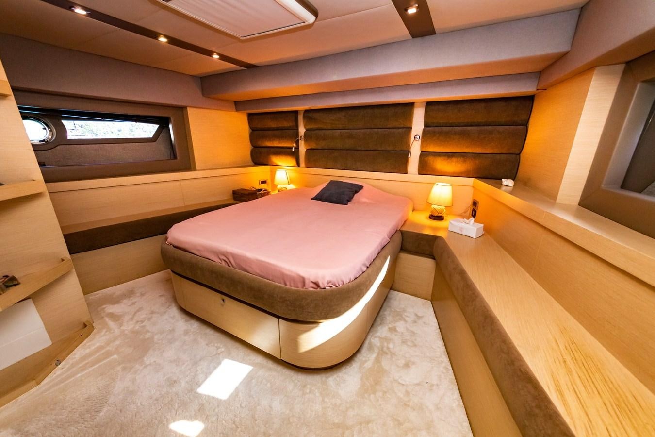 a room with a bed and a desk aboard WATER Yacht for Sale