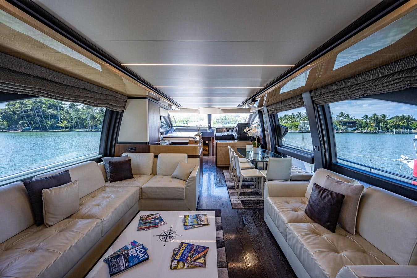 a living room with a large window aboard STAYSEA Yacht for Sale