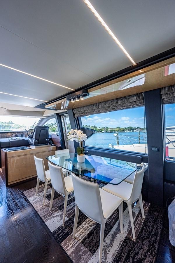 a room with a table and chairs aboard STAYSEA Yacht for Sale