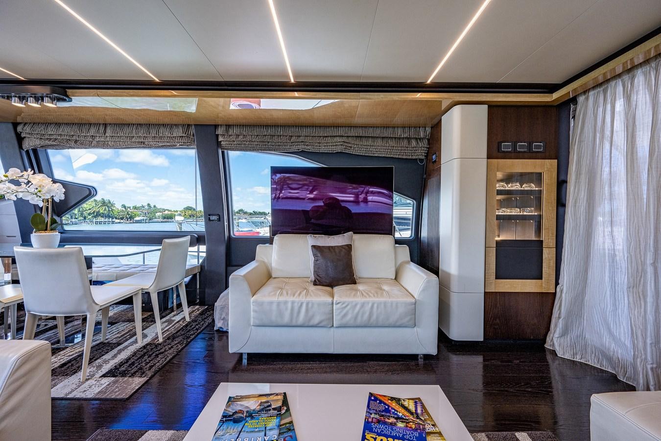 a living room with a large window aboard STAYSEA Yacht for Sale