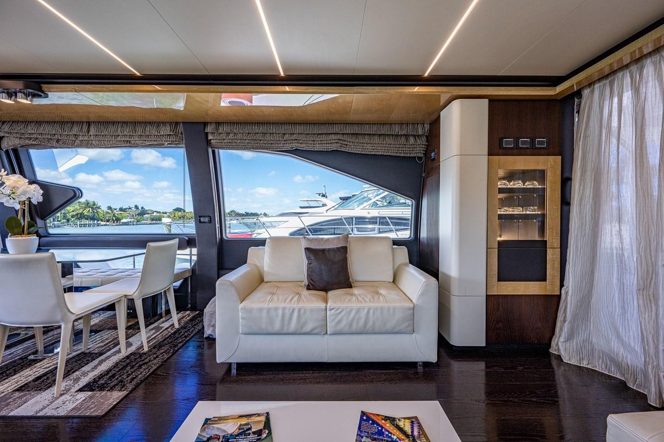 a living room with a large window aboard STAYSEA Yacht for Sale
