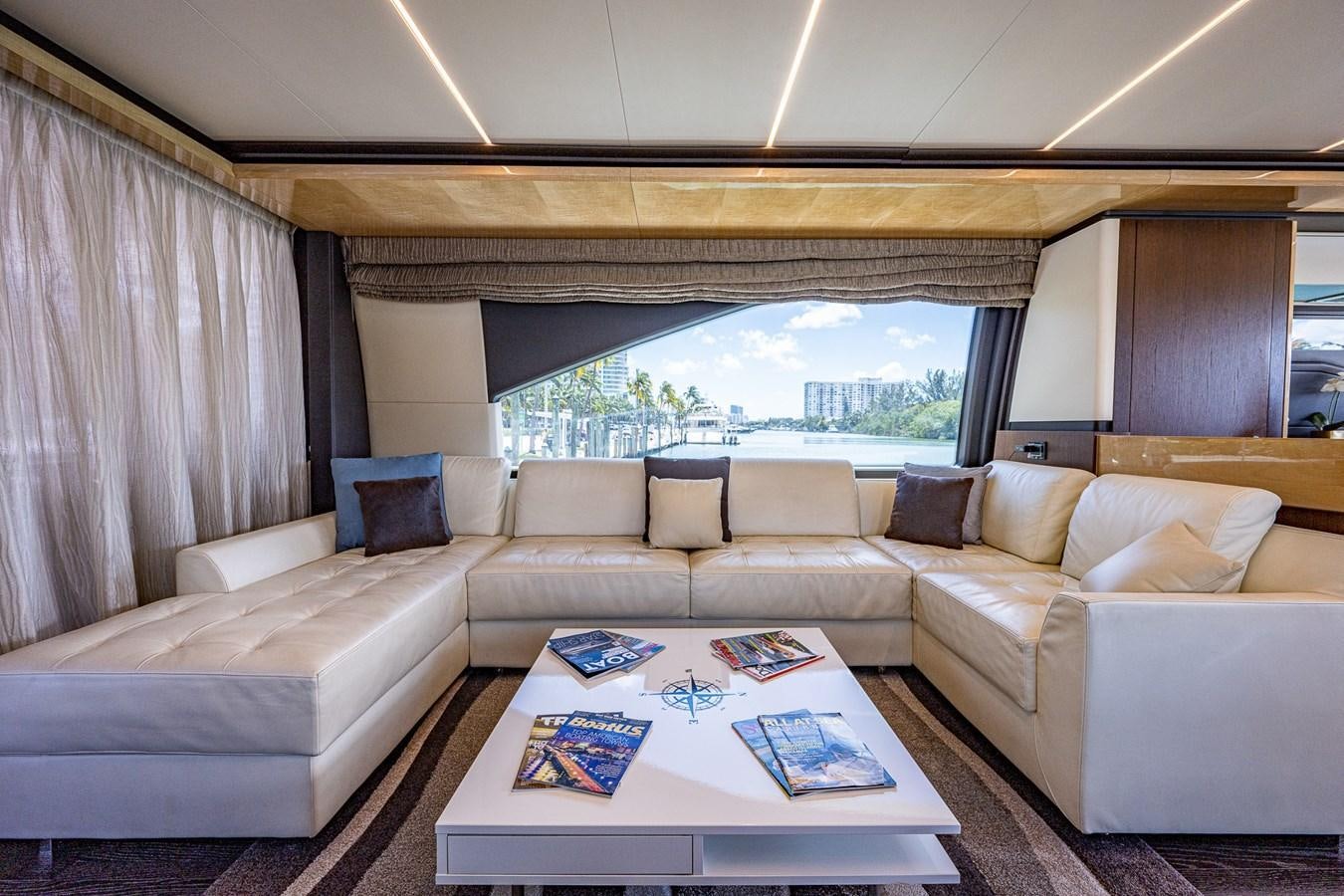 a living room with a large window aboard STAYSEA Yacht for Sale