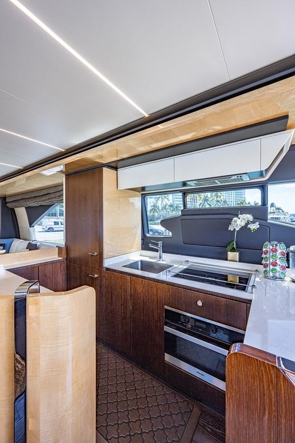 a kitchen with a large window aboard STAYSEA Yacht for Sale