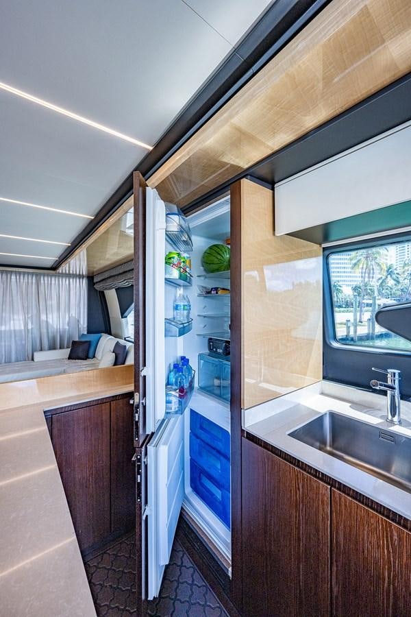 a kitchen with a glass door aboard STAYSEA Yacht for Sale