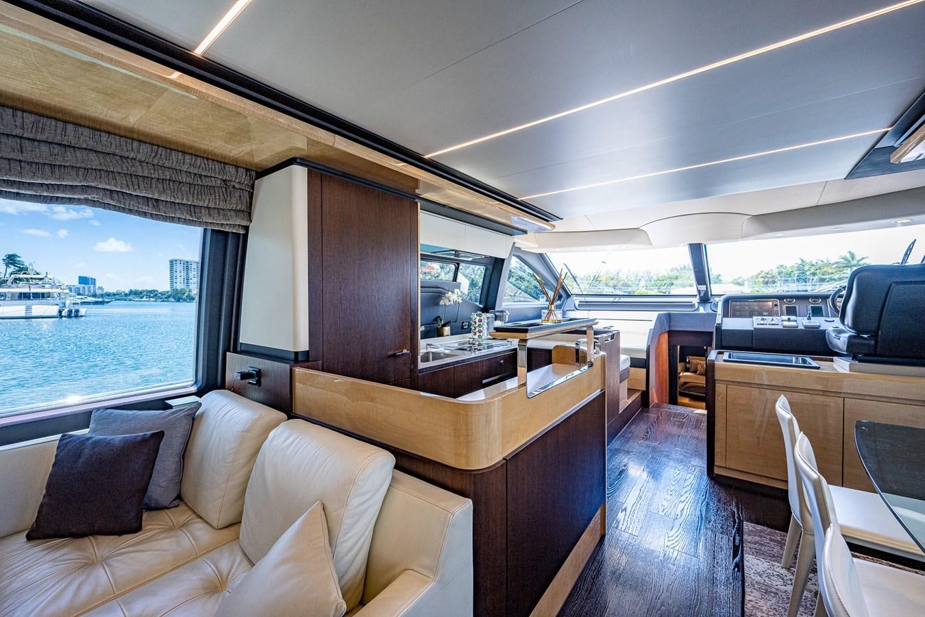 a room with a couch and a table and a window aboard STAYSEA Yacht for Sale