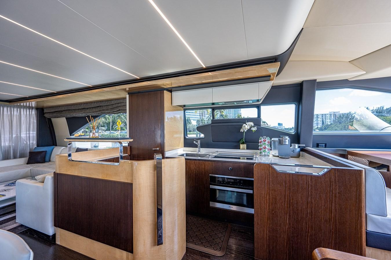 a kitchen with a large window aboard STAYSEA Yacht for Sale