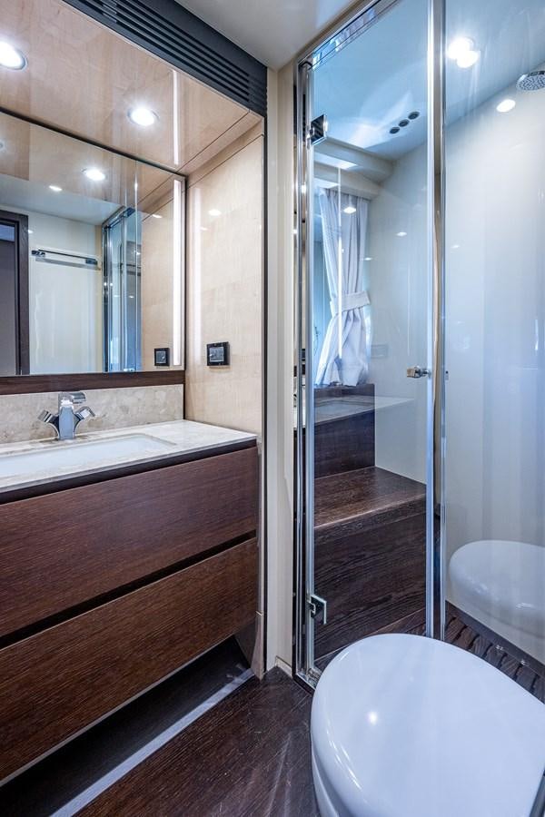 a bathroom with a glass shower aboard STAYSEA Yacht for Sale