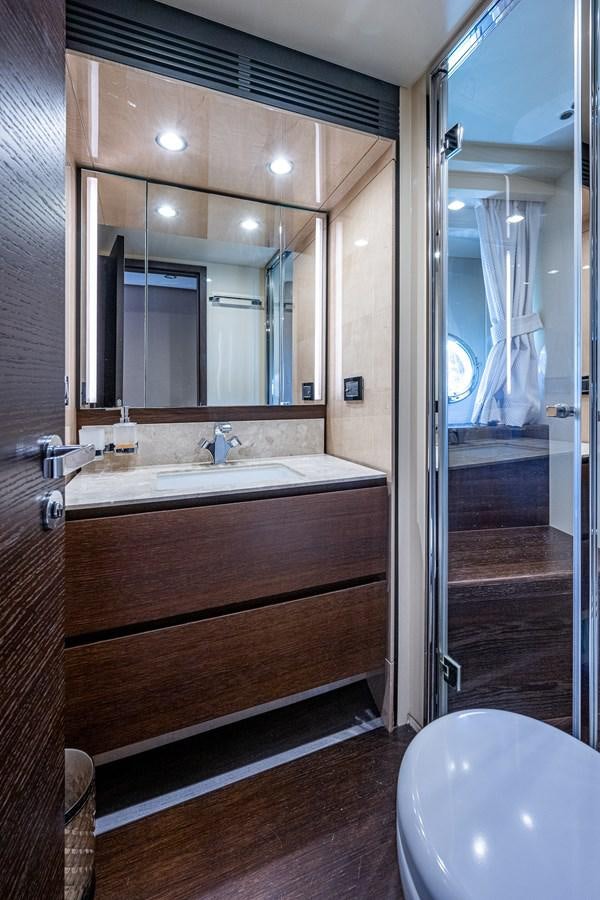 a bathroom with a large mirror aboard STAYSEA Yacht for Sale