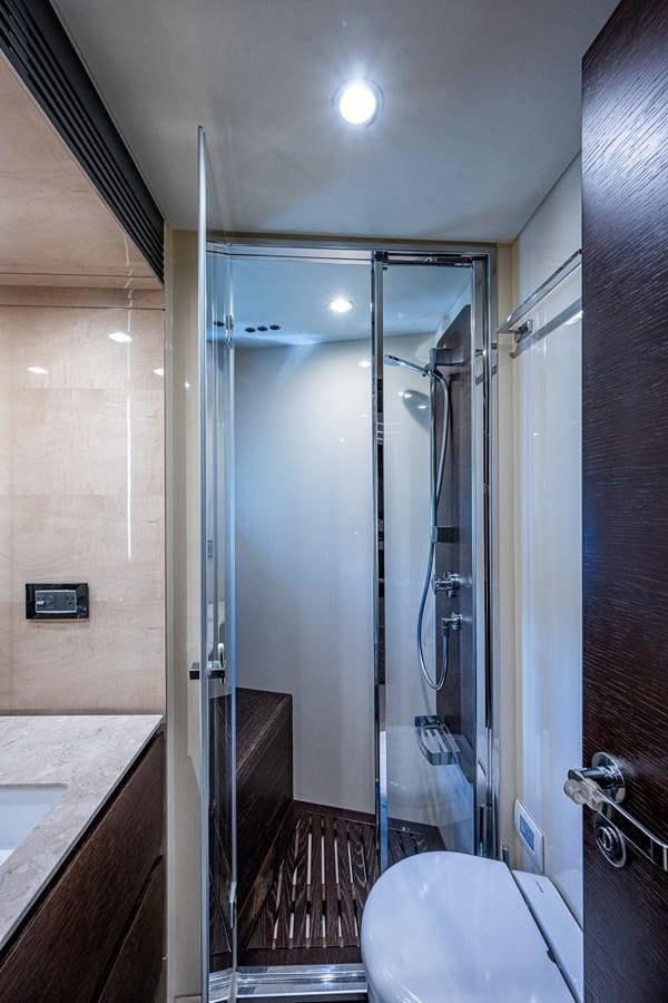 a bathroom with a glass shower aboard STAYSEA Yacht for Sale