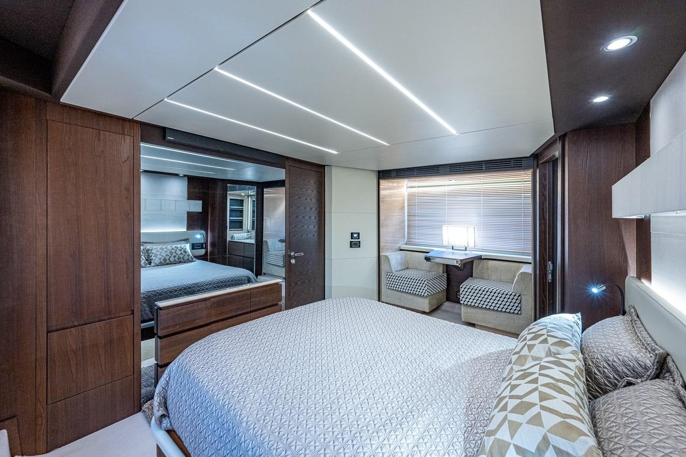 a bedroom with a bed and a desk aboard STAYSEA Yacht for Sale