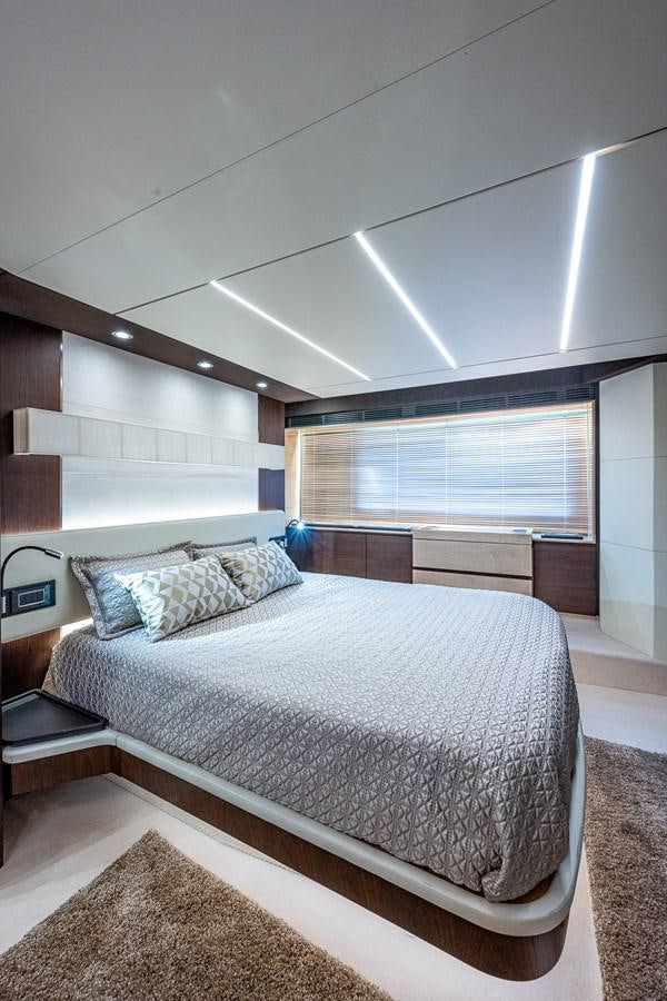 a bedroom with a large bed aboard STAYSEA Yacht for Sale