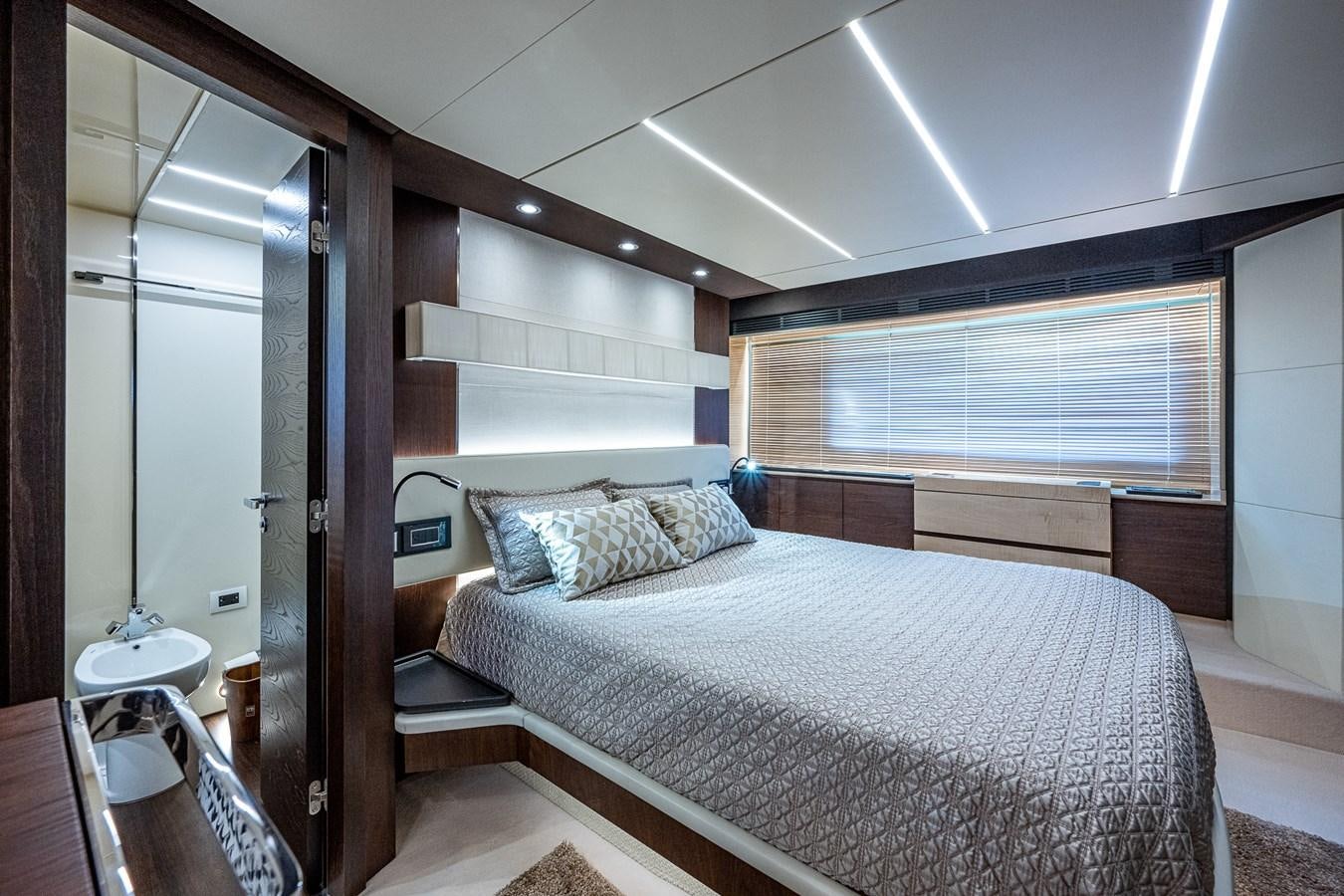 a bedroom with a large bed aboard STAYSEA Yacht for Sale