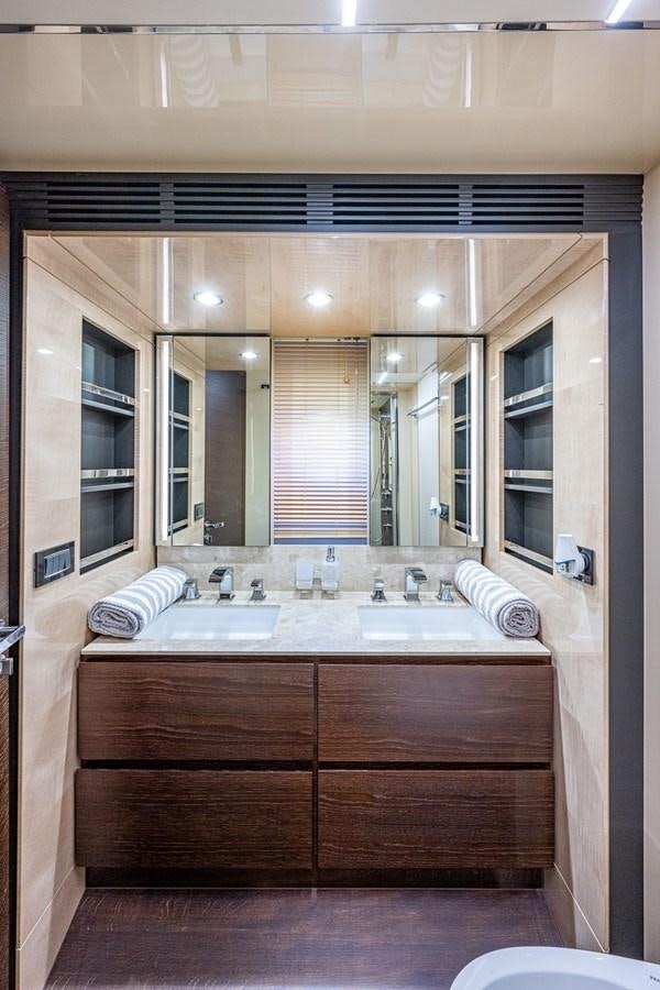 a bathroom with a sink and a mirror aboard STAYSEA Yacht for Sale