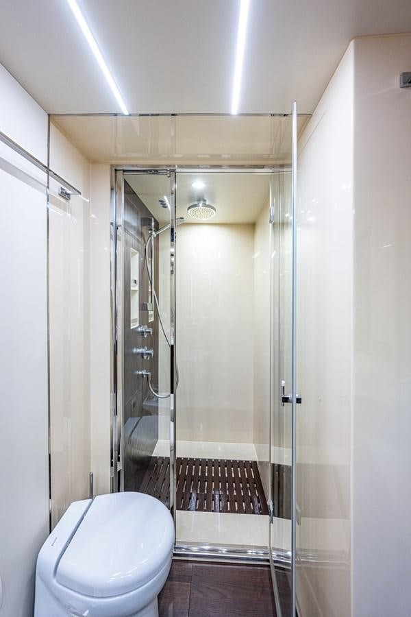 a bathroom with a glass shower aboard STAYSEA Yacht for Sale