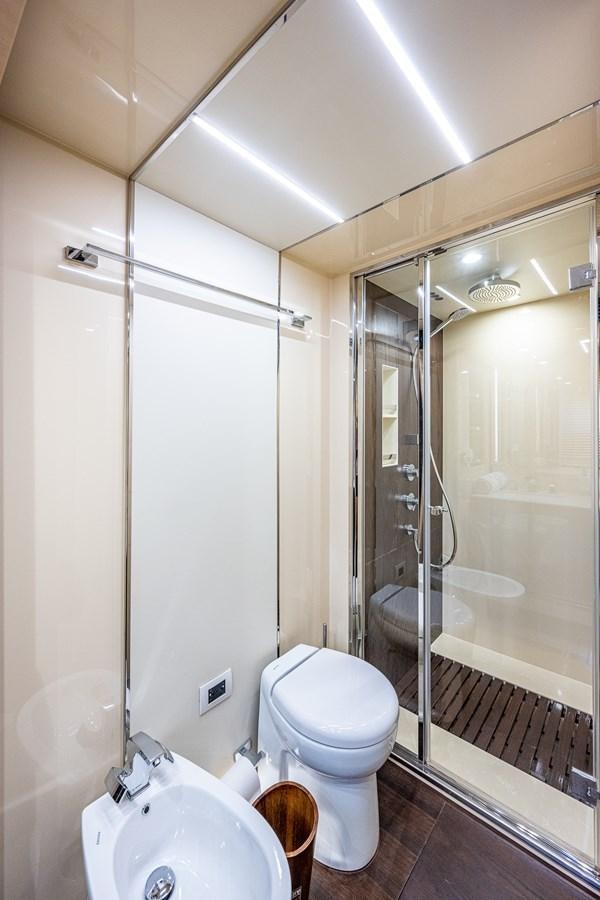a bathroom with a glass shower aboard STAYSEA Yacht for Sale