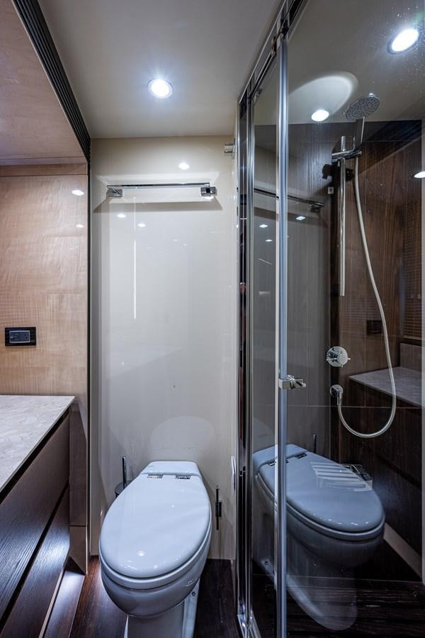 a bathroom with a glass shower aboard STAYSEA Yacht for Sale