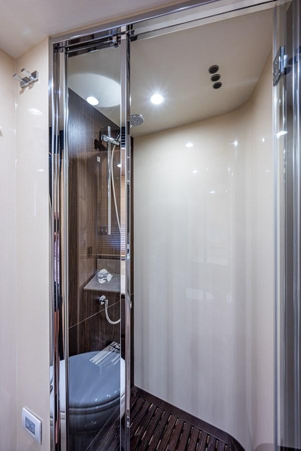 a bathroom with a glass shower aboard STAYSEA Yacht for Sale