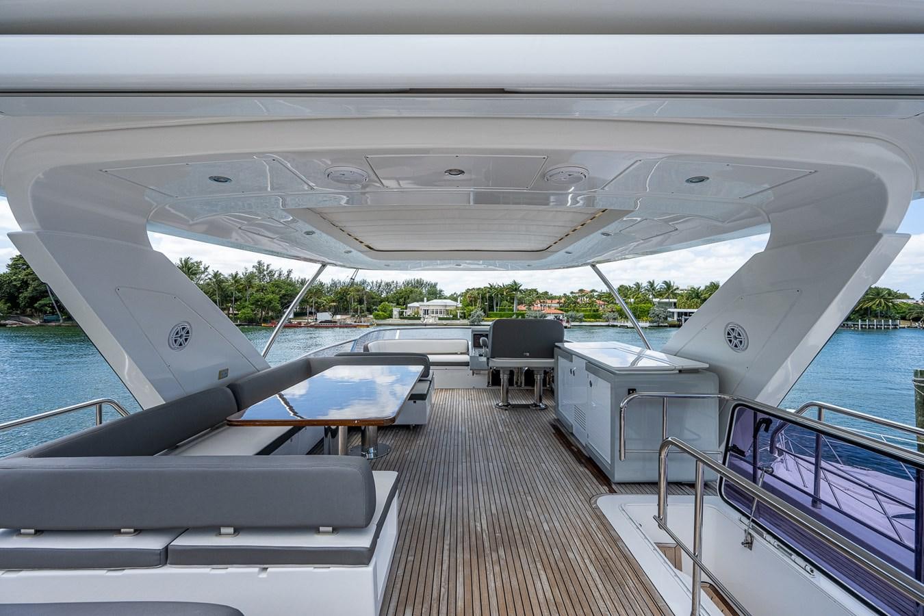 a deck with a pool and a deck with chairs and a deck aboard STAYSEA Yacht for Sale