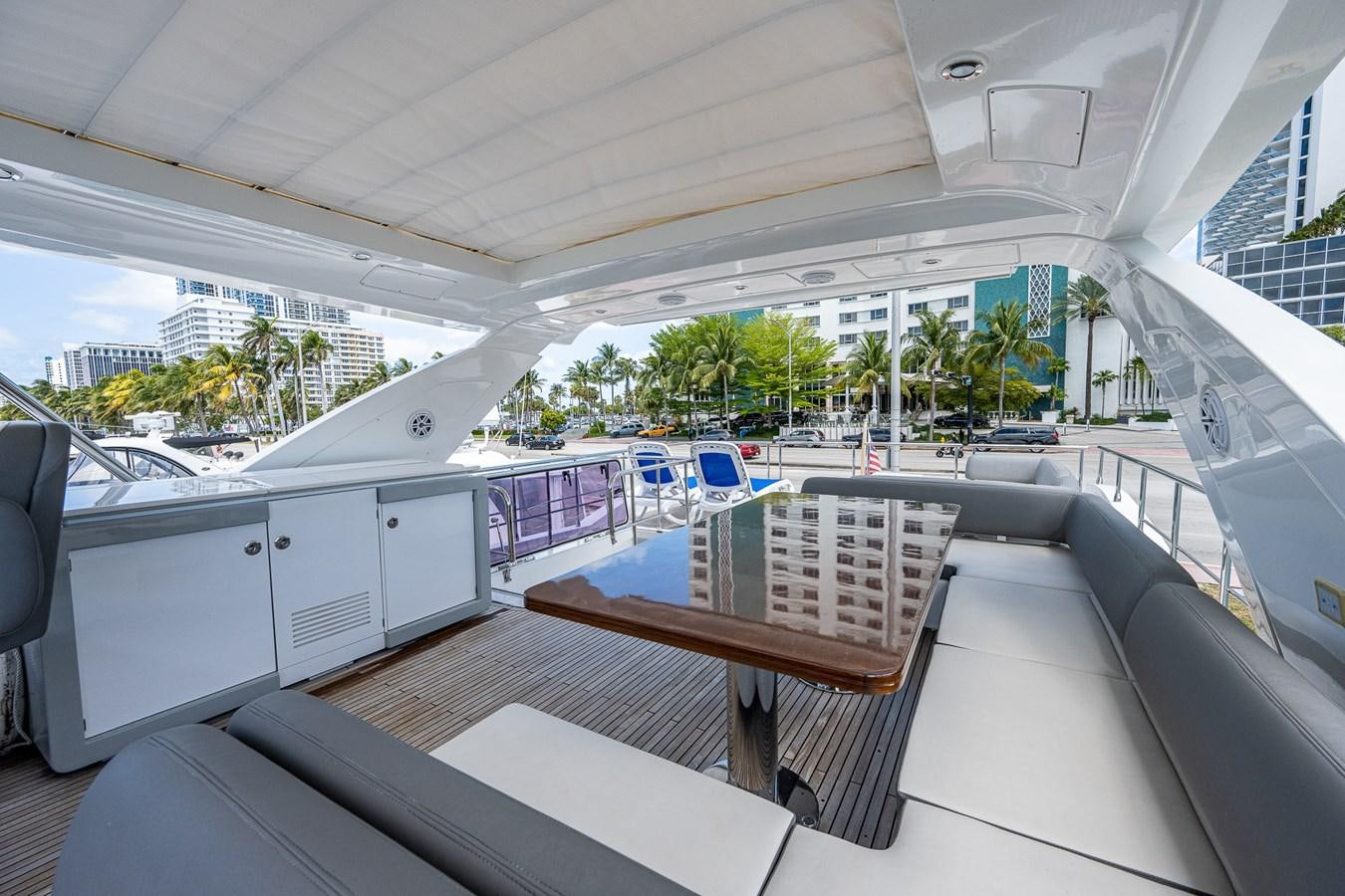 a deck with a bench and chairs aboard STAYSEA Yacht for Sale
