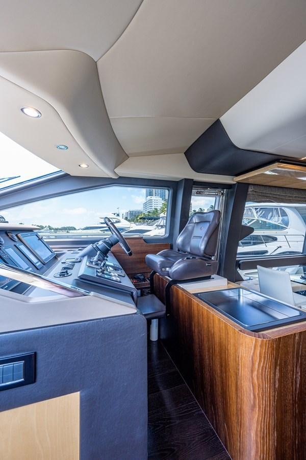 inside of a vehicle with a desk and a laptop on a table aboard STAYSEA Yacht for Sale