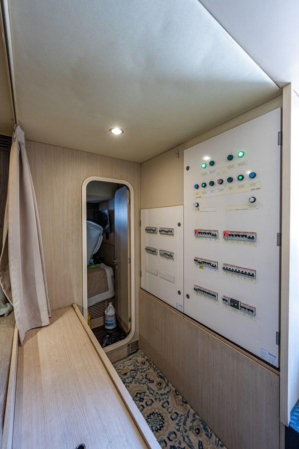 a hallway with a door and a mirror aboard STAYSEA Yacht for Sale