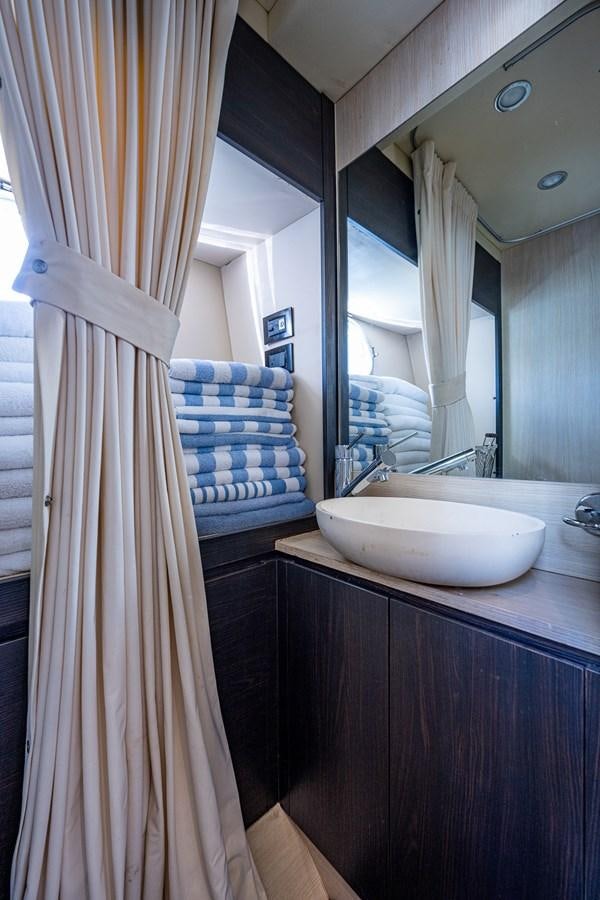 a bathroom with a sink and a mirror aboard STAYSEA Yacht for Sale