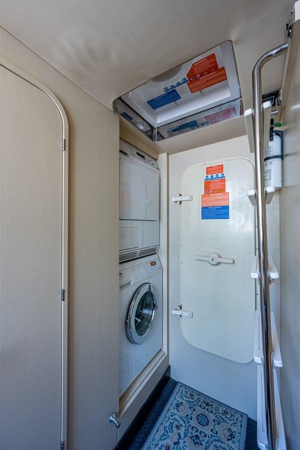 a white machine with a sign on the door aboard STAYSEA Yacht for Sale