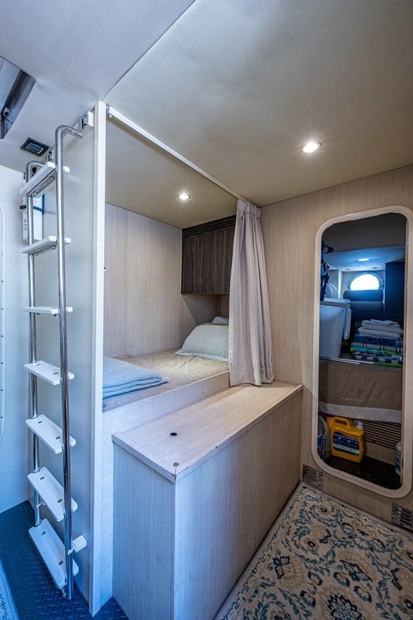 a bedroom with a glass door aboard STAYSEA Yacht for Sale