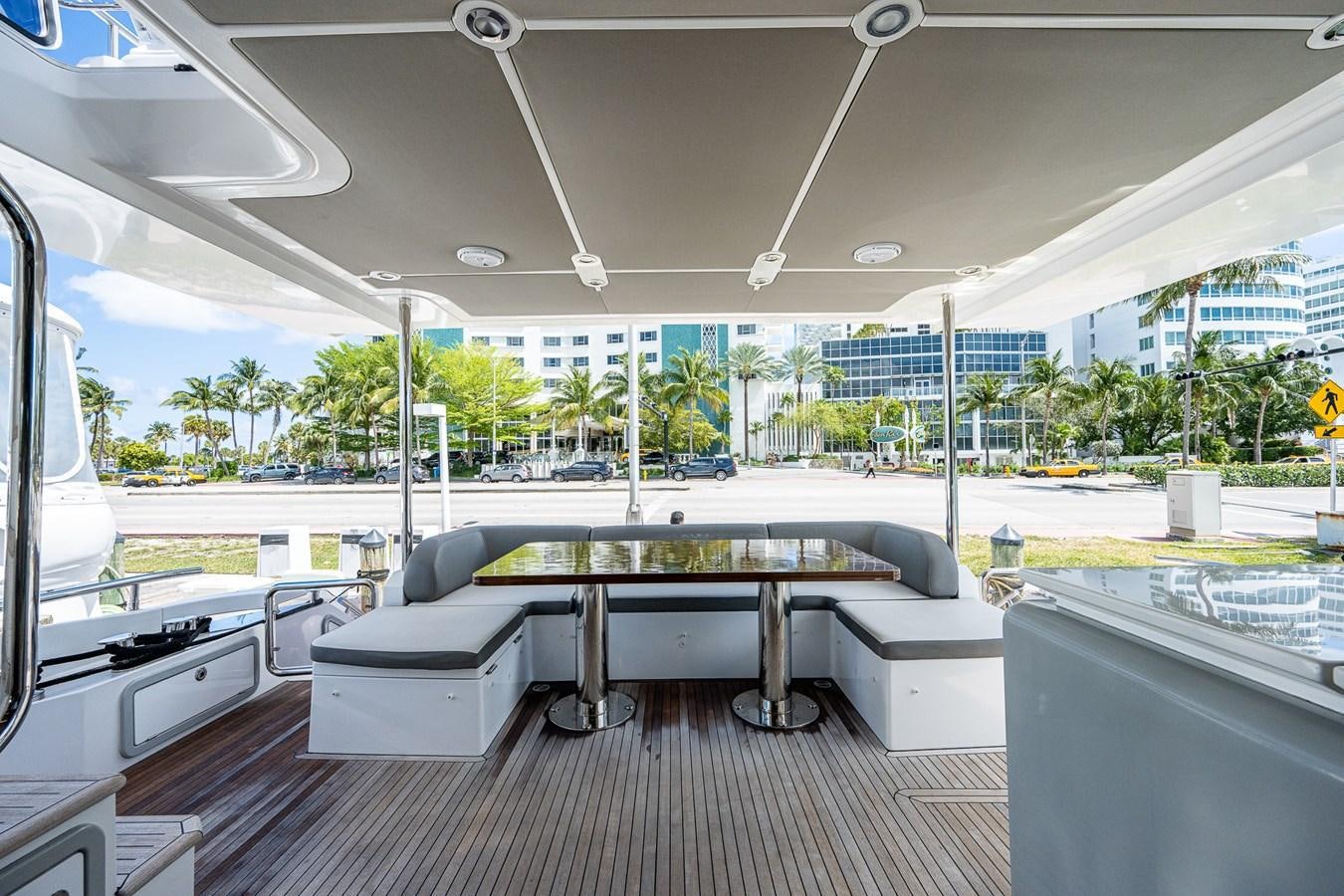 a room with a table and chairs aboard STAYSEA Yacht for Sale