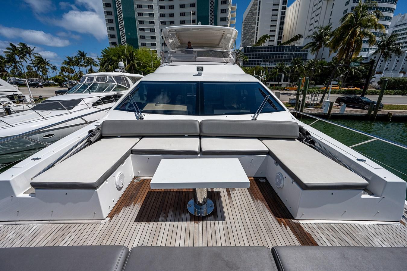 a white boat on a deck aboard STAYSEA Yacht for Sale
