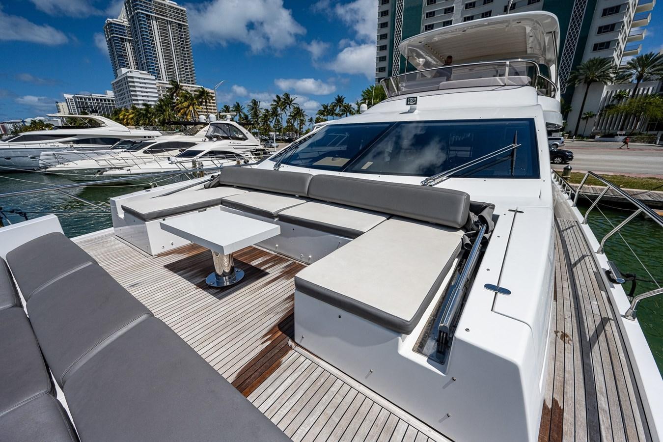 a white boat in a harbor aboard STAYSEA Yacht for Sale