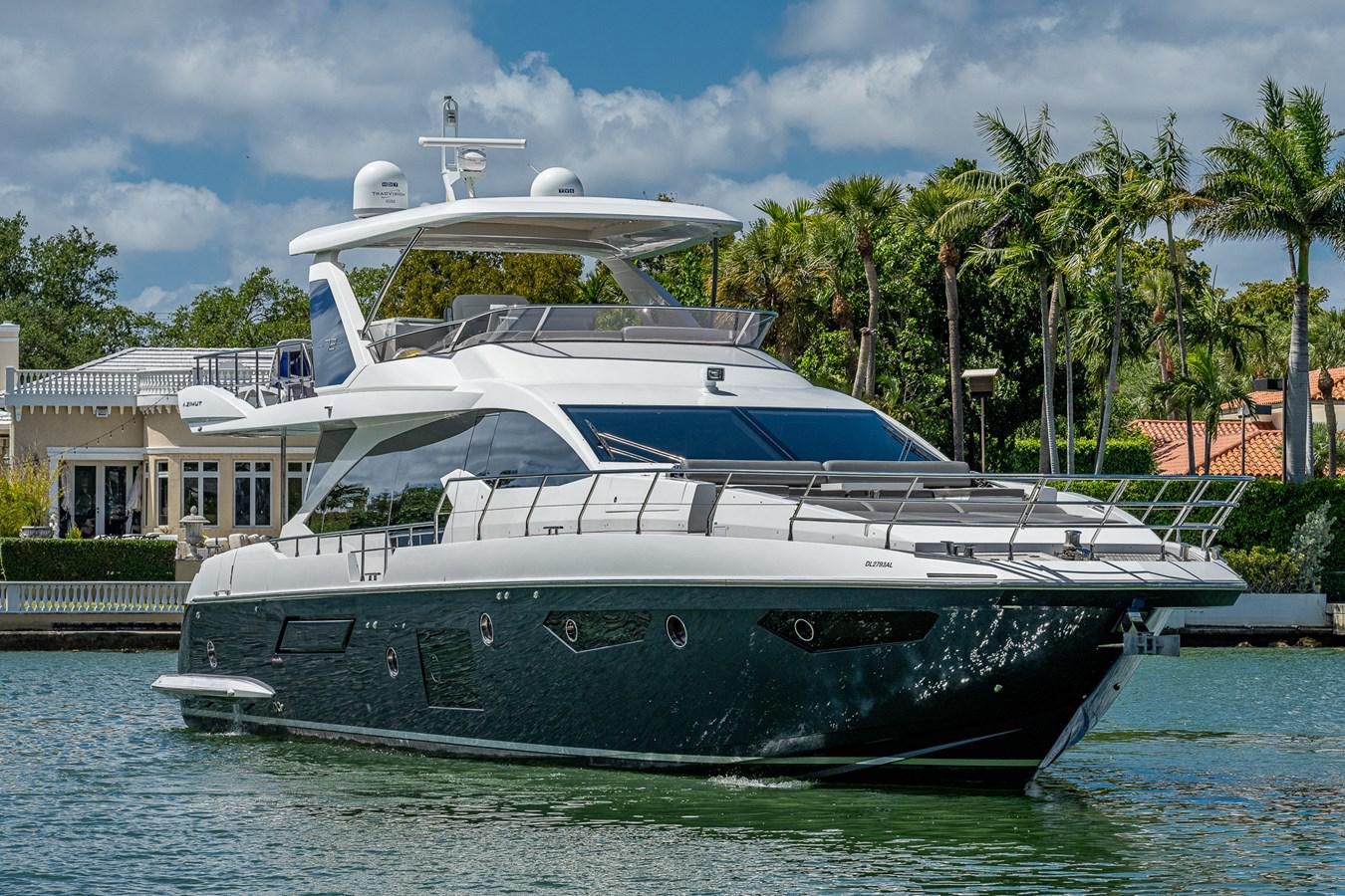 a large white boat in a harbor aboard STAYSEA Yacht for Sale