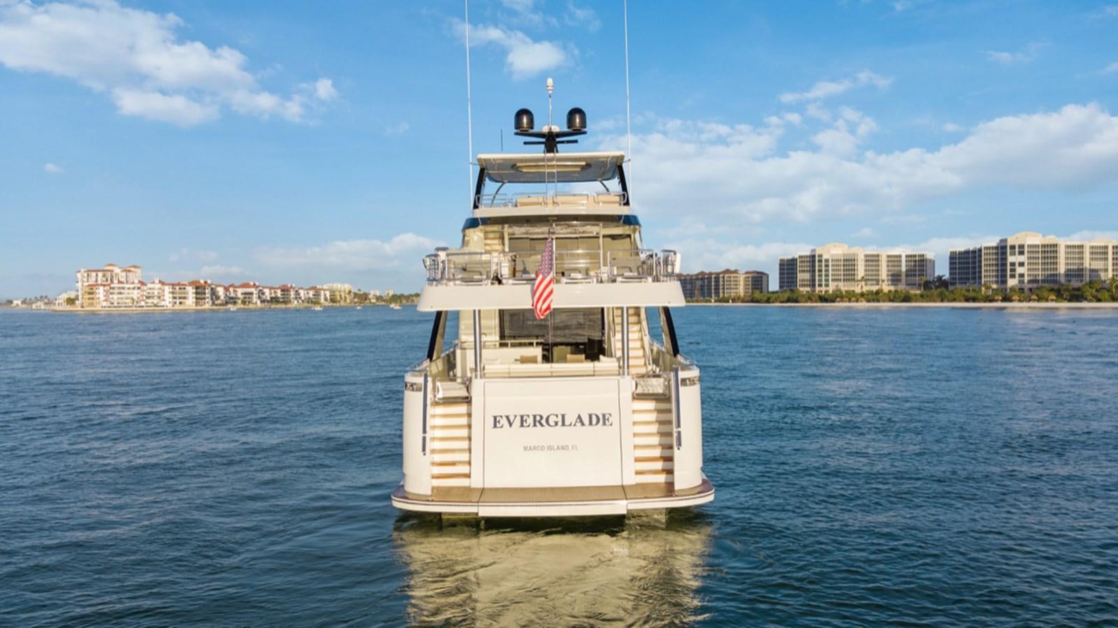 a large white boat on the water aboard EVERGLADE Yacht for Sale