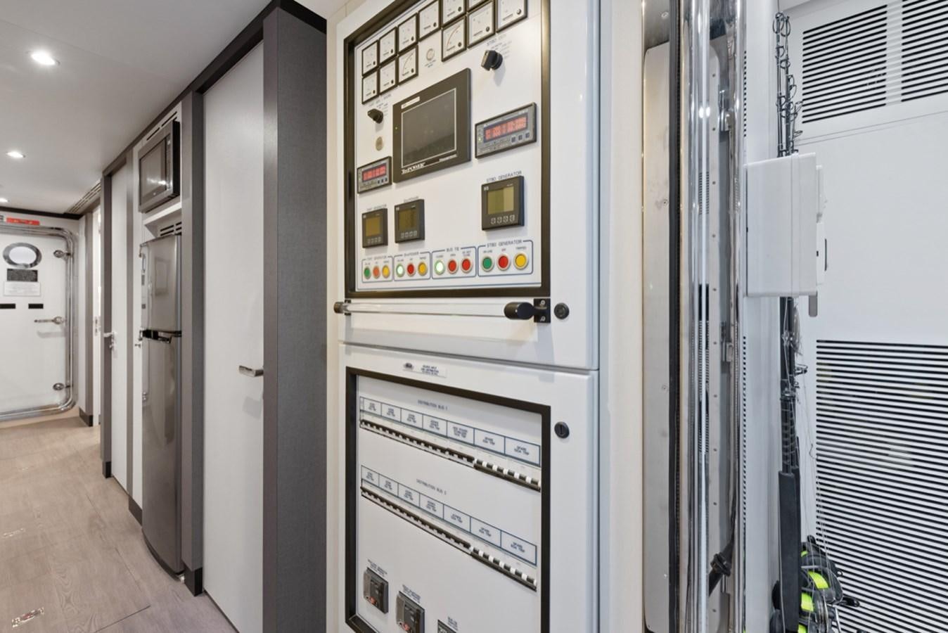 a hallway with a few doors aboard EVERGLADE Yacht for Sale