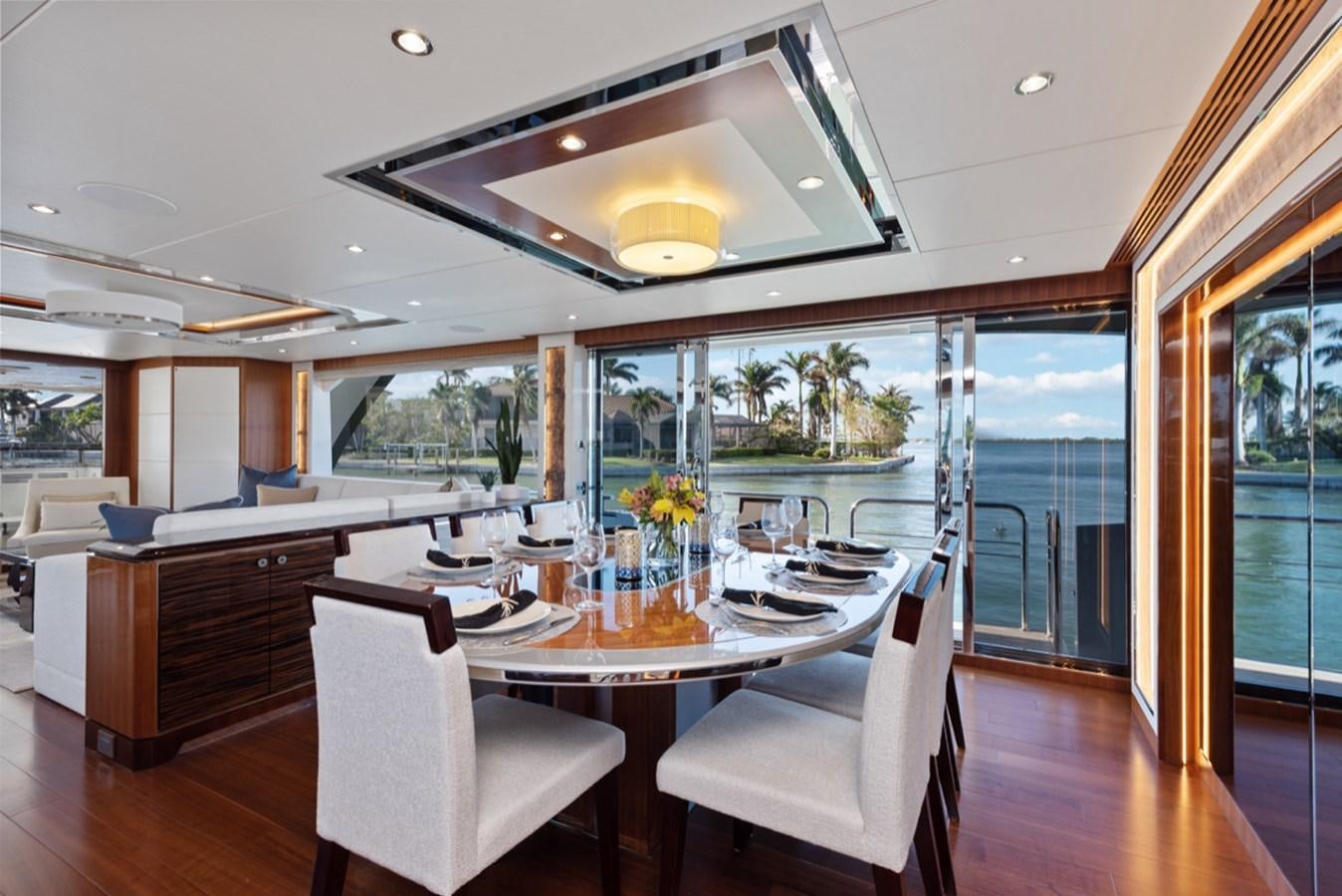 a kitchen with a dining table aboard EVERGLADE Yacht for Sale