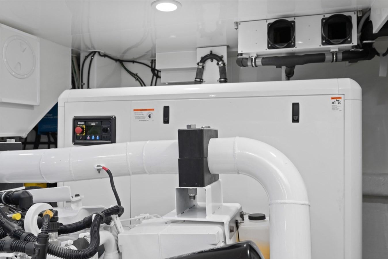 a machine with a black object on the side aboard EVERGLADE Yacht for Sale