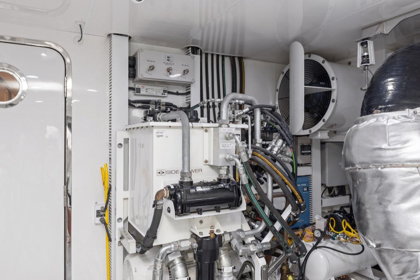 a machine with a large piece of equipment in it aboard EVERGLADE Yacht for Sale