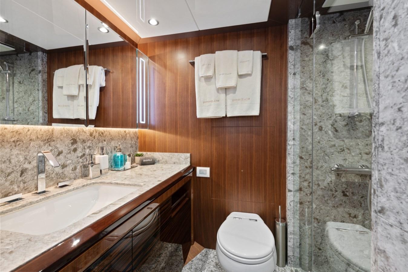 a bathroom with a sink and a toilet aboard EVERGLADE Yacht for Sale