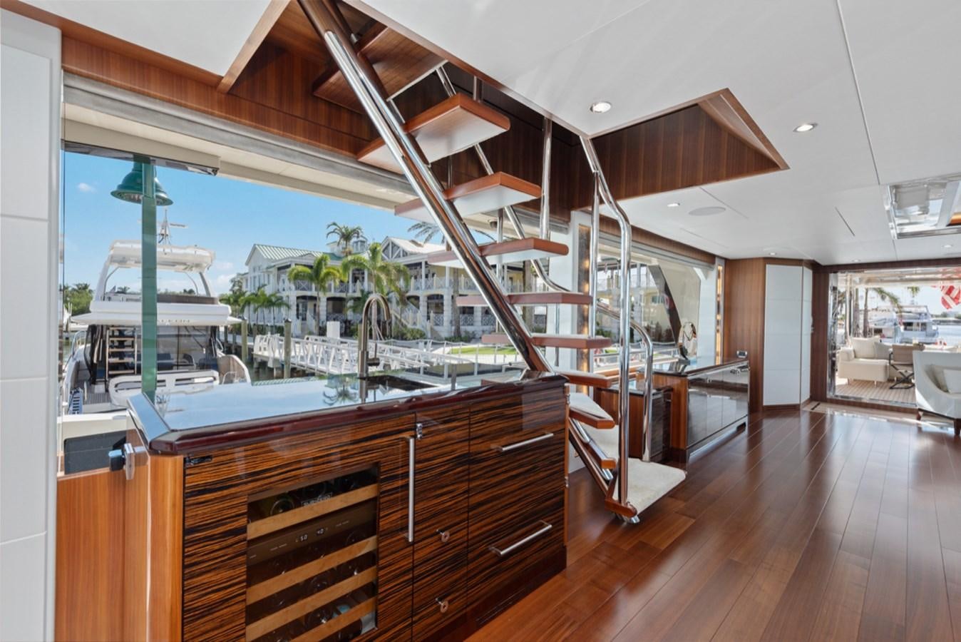 a kitchen with a wood floor aboard EVERGLADE Yacht for Sale