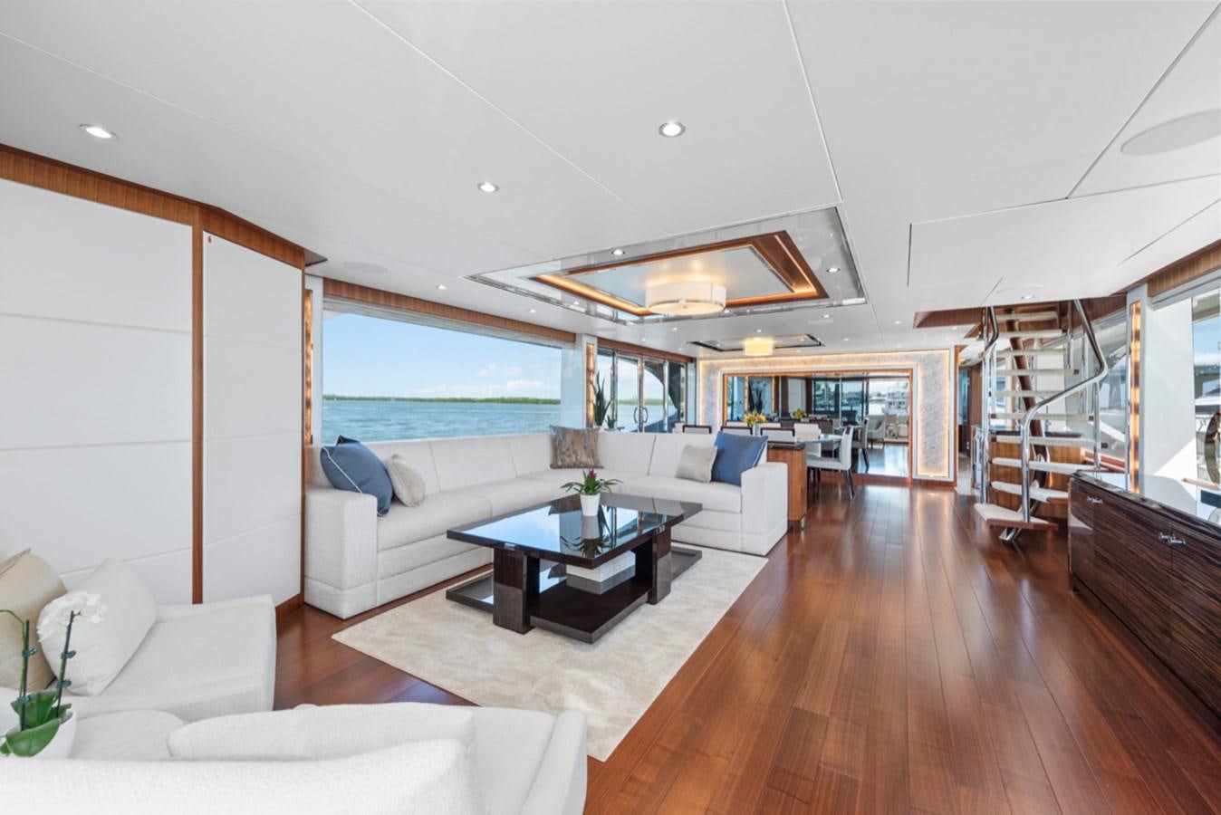 a living room with a wood floor aboard EVERGLADE Yacht for Sale