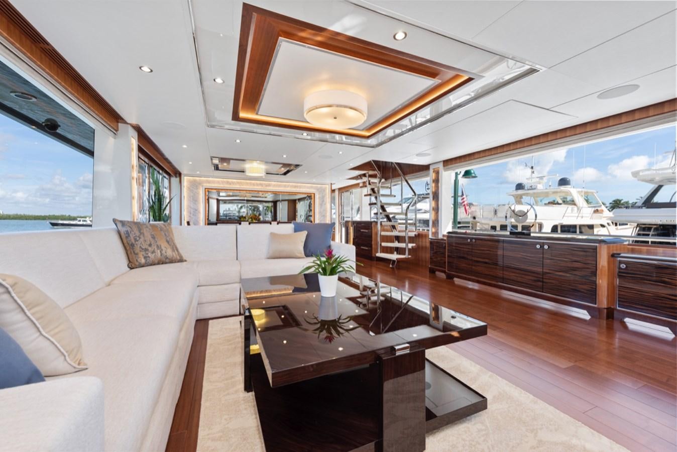 a living room with a large window aboard EVERGLADE Yacht for Sale