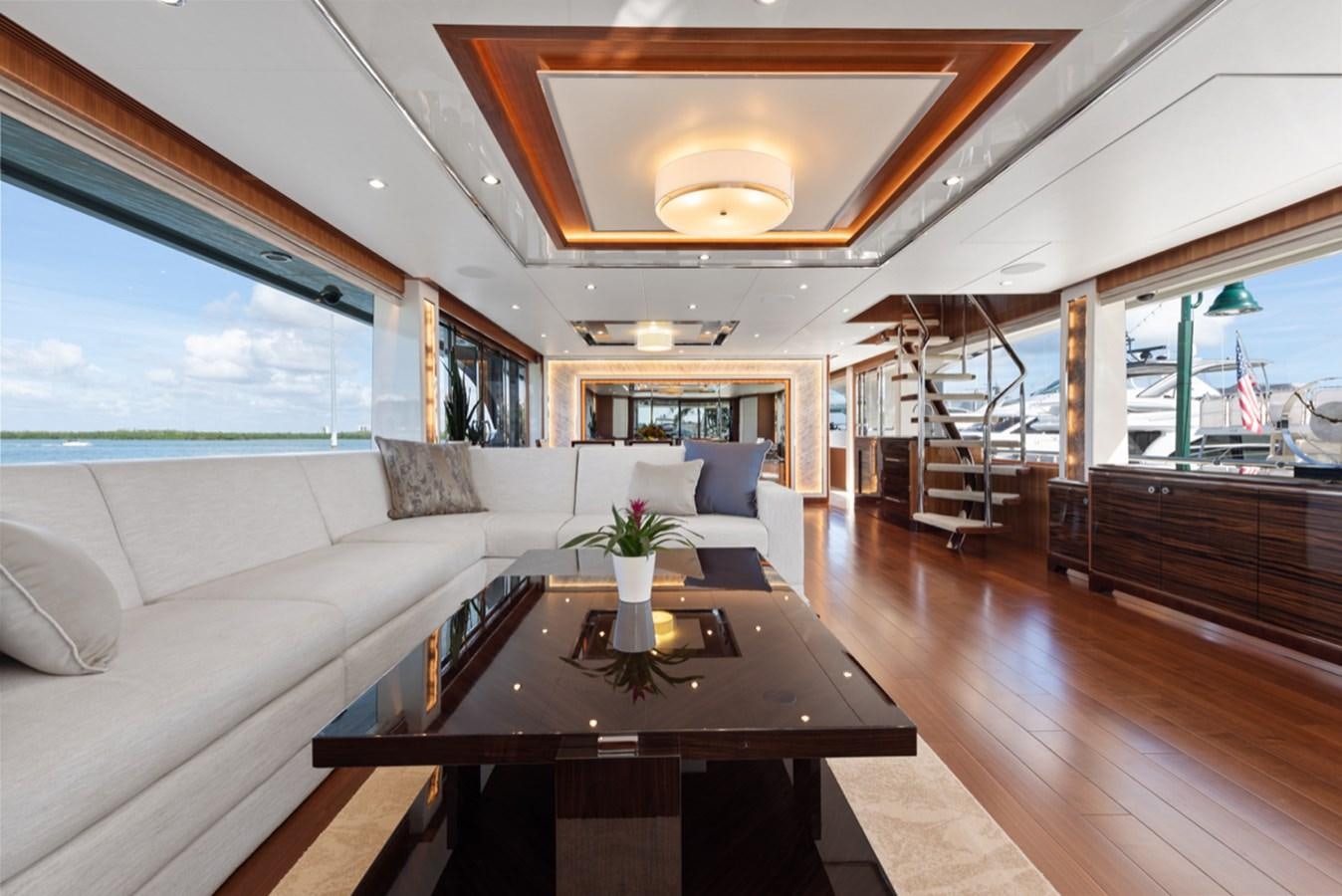 a living room with a large window aboard EVERGLADE Yacht for Sale