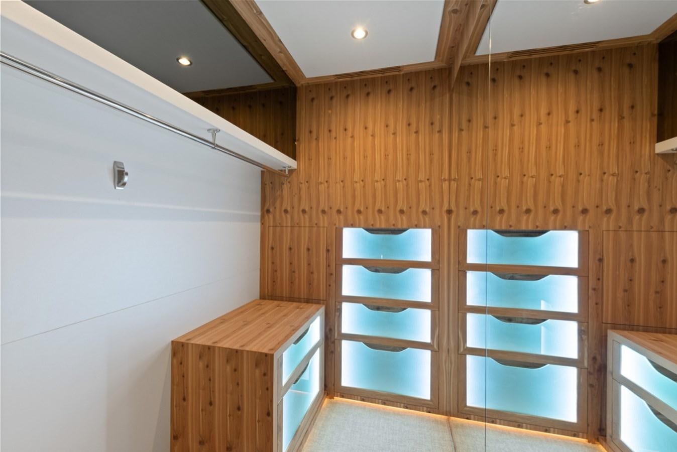 a wooden room with a wood wall aboard EVERGLADE Yacht for Sale