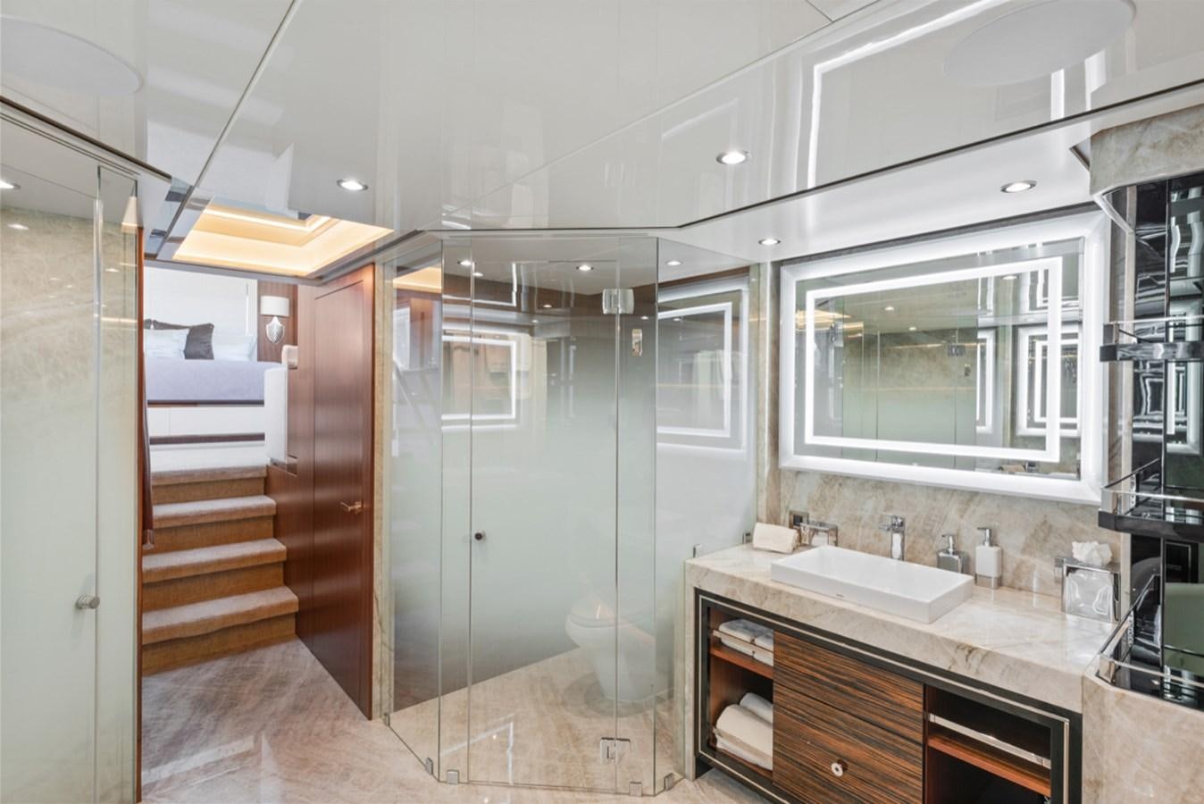 a bathroom with a sink and a mirror aboard EVERGLADE Yacht for Sale