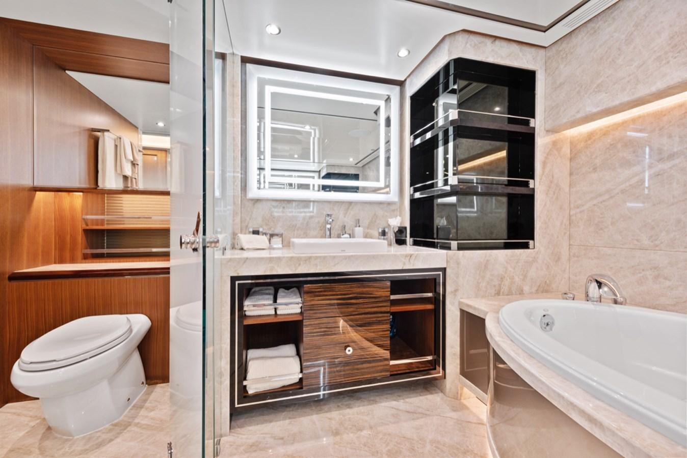 a bathroom with a sink and a toilet aboard EVERGLADE Yacht for Sale