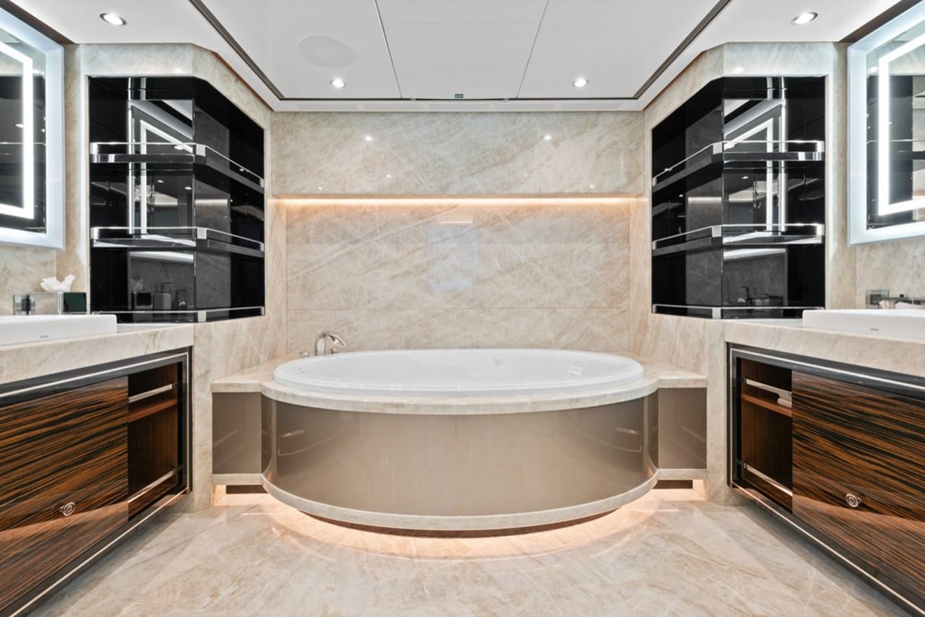 a large bathroom with a large tub aboard EVERGLADE Yacht for Sale