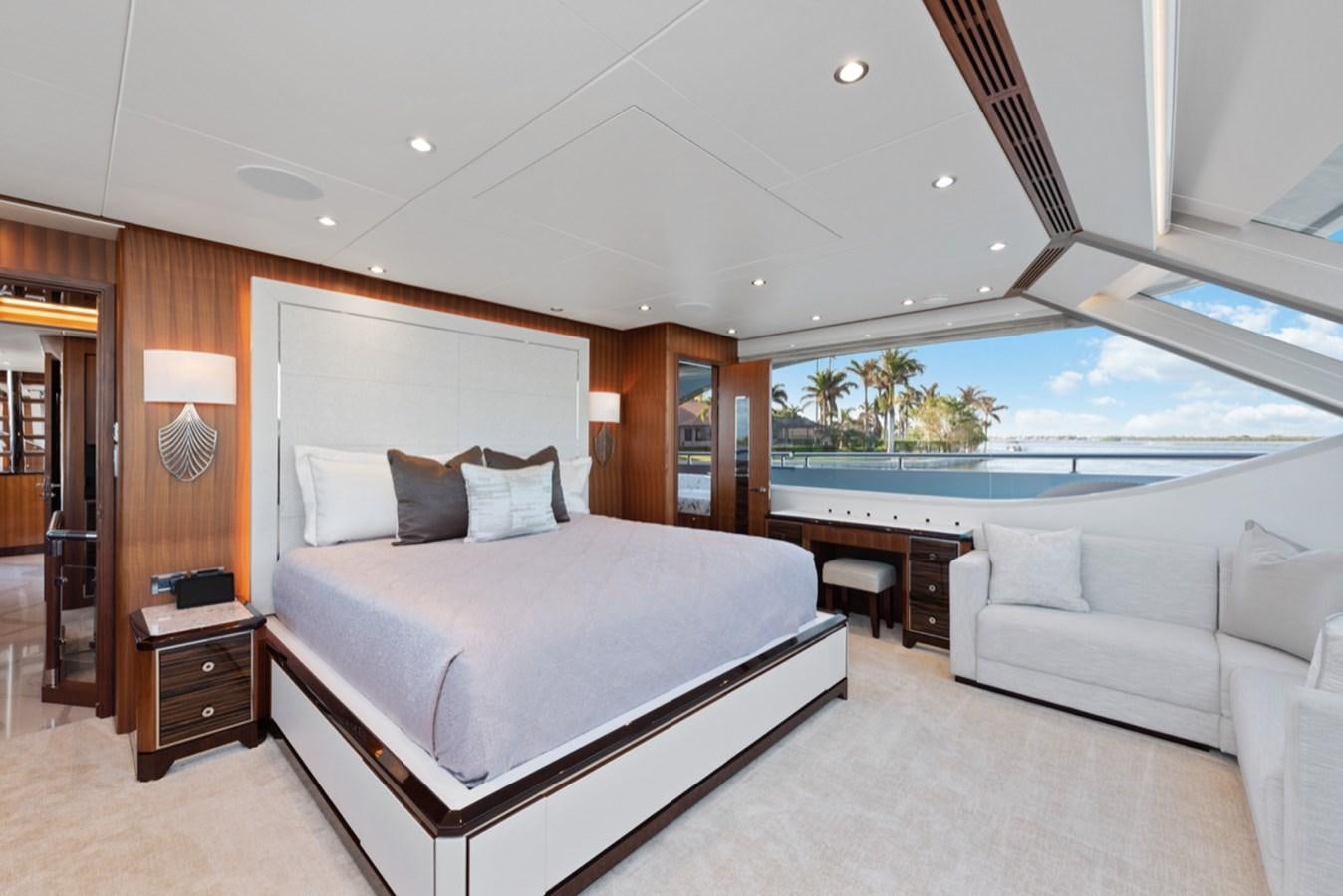 a large bedroom with a large bed aboard EVERGLADE Yacht for Sale