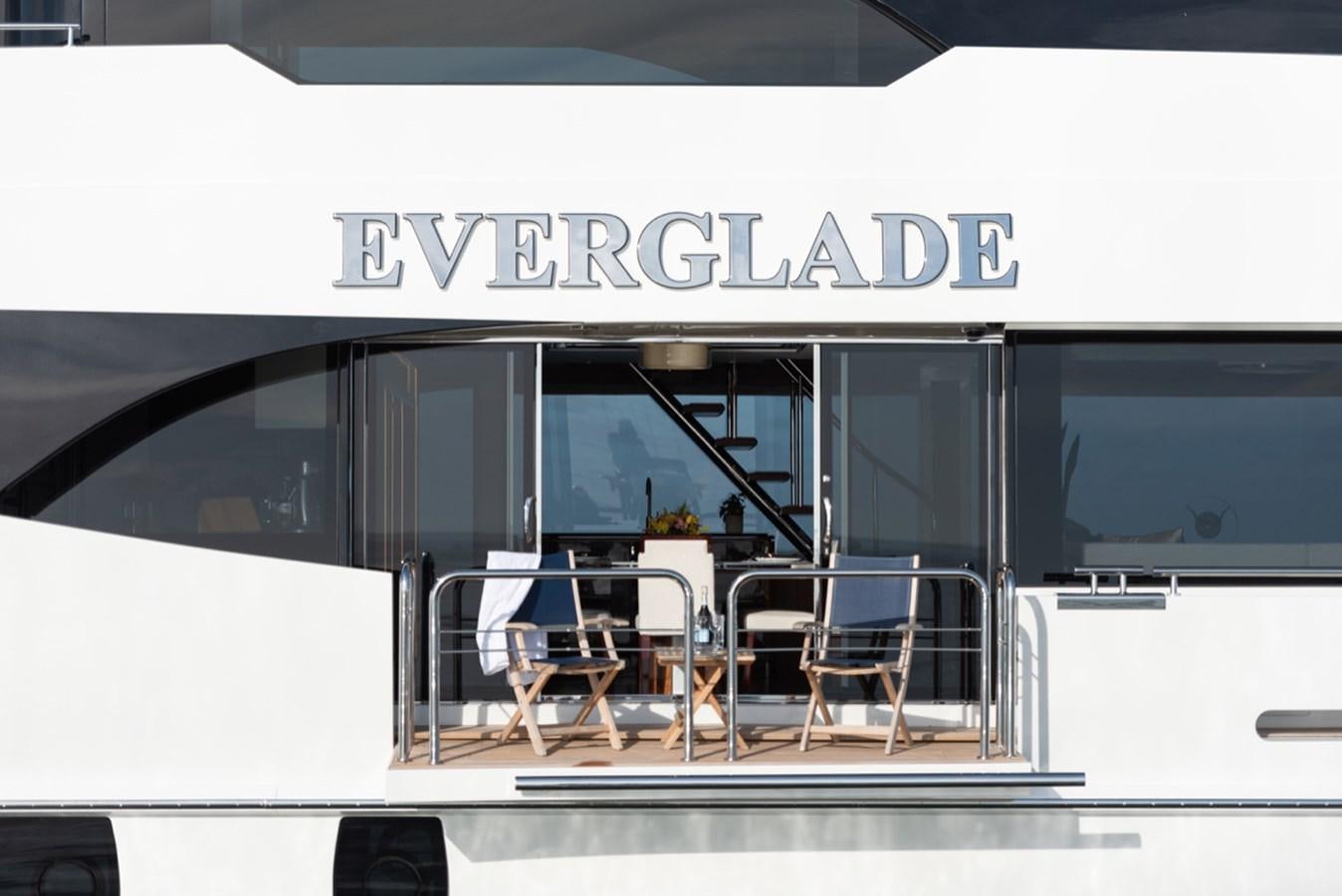a white van with a table and chairs outside aboard EVERGLADE Yacht for Sale