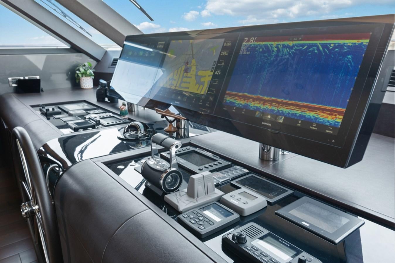 a computer on a desk aboard EVERGLADE Yacht for Sale