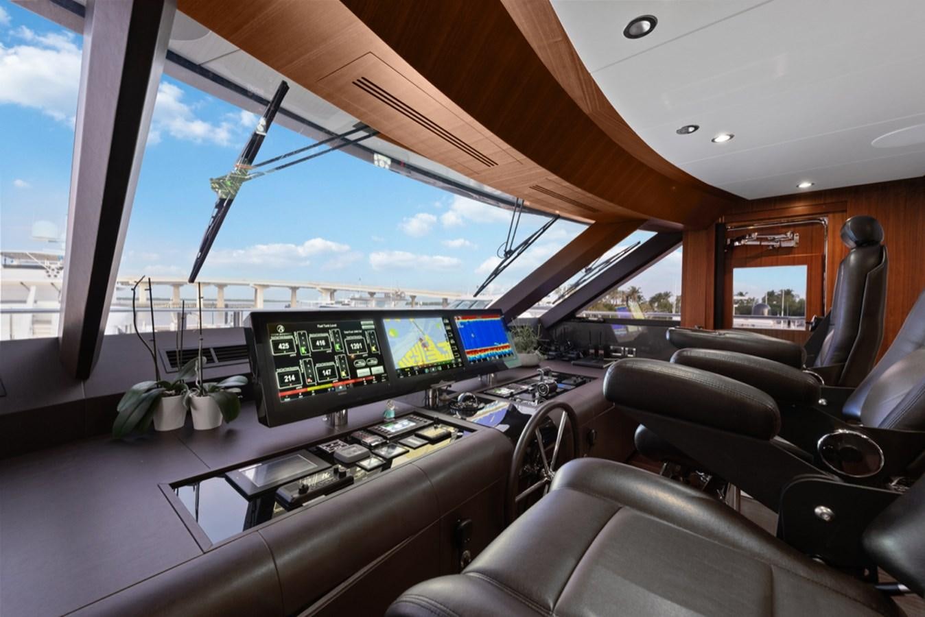 inside of a car with a view of the mountains and the sun aboard EVERGLADE Yacht for Sale